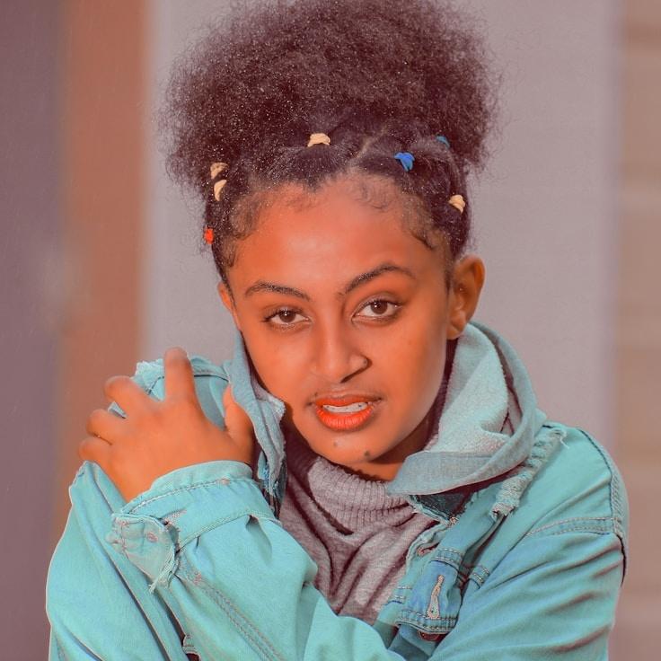 Amara Singh, Lead Design Curator at SilentMarbleHaven, reviewing corporate floral arrangements